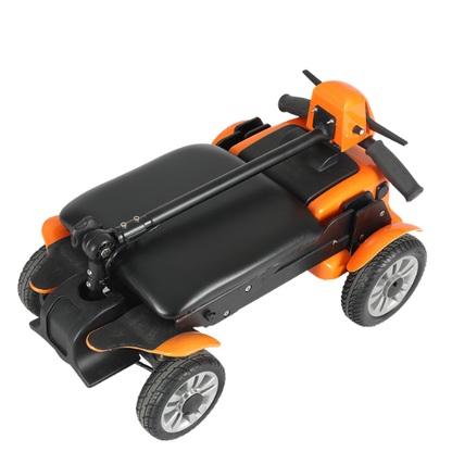 A compact orange and black folding mobility scooter with four wheels and a seat.